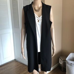 Sleeveless black blazer type piece